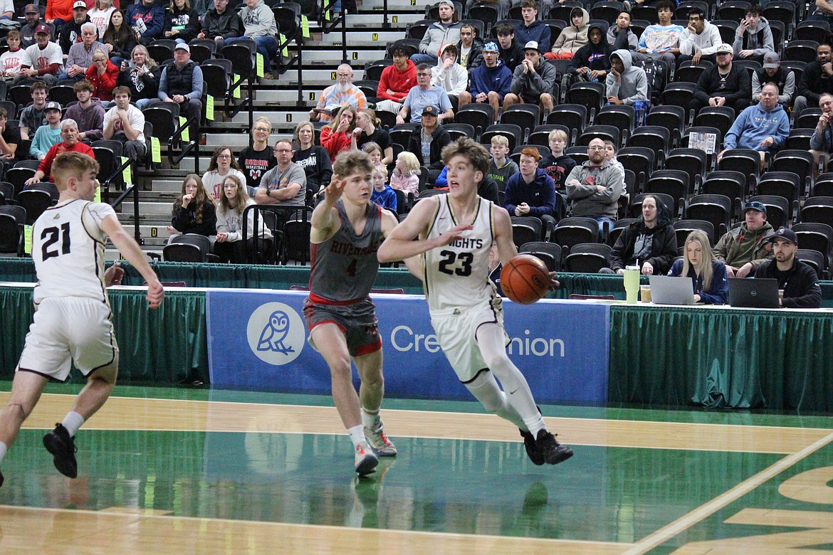 Caden Allred (23) of Royal tries to drive the lane in Wednesday’s state basketball game against Riverside.