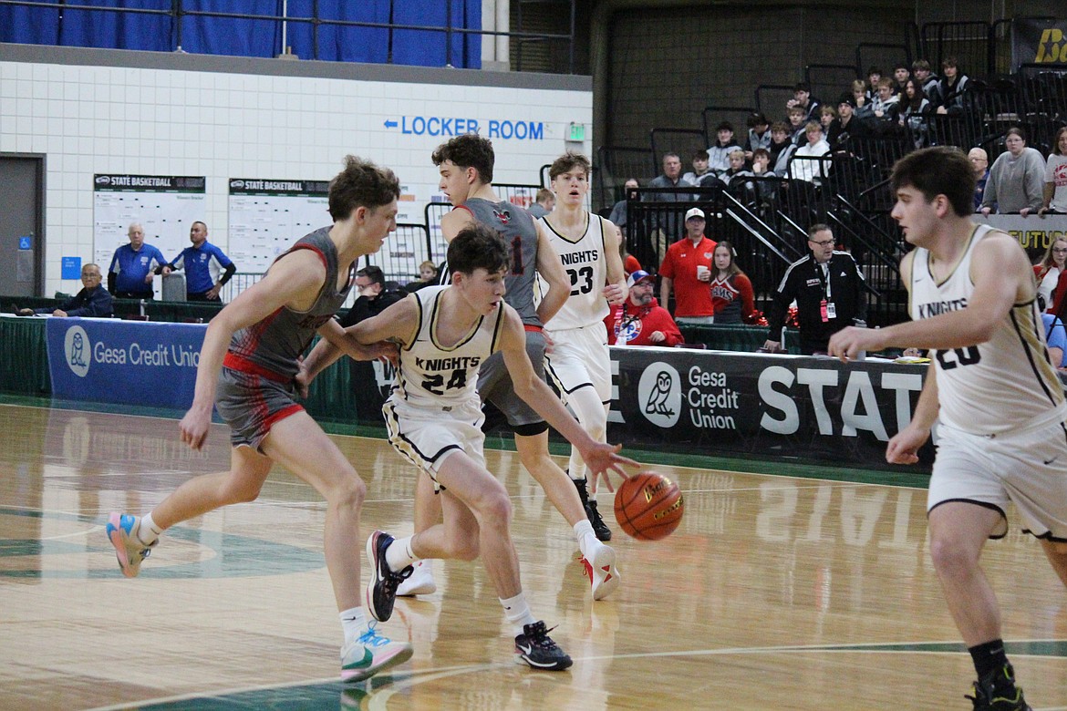 Grant Wardenaar (24) of Royal pushes the ball up the court in the Knights’ game against Riverside in the 1A state tournament Wednesday.