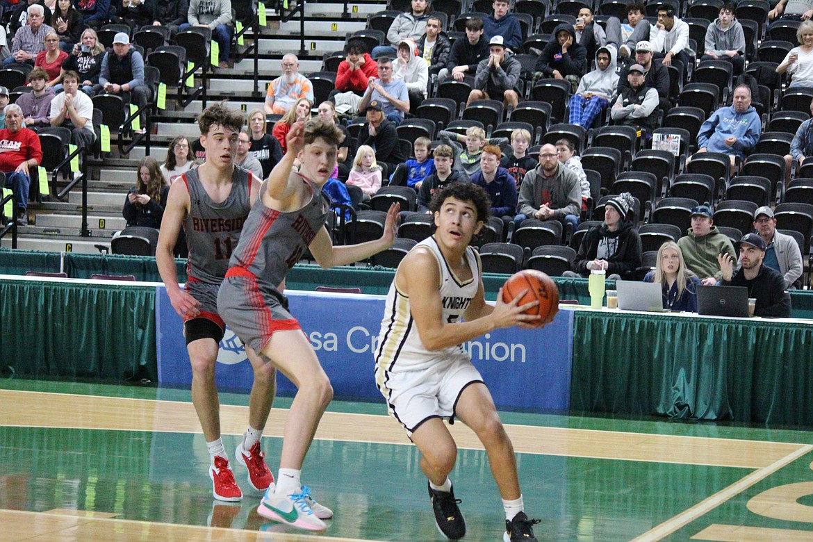 Royal’s Santana Luna, in white, goes for the basket.