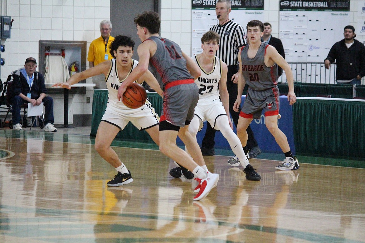 Royal’s intense defensive pressure wasn’t quite enough to offset Riverside’s rebounding advantage in the Knights’ 55-40 loss at the 1A state tournament Wednesday. Santana Luna (5) and Caden Allred (23) keep a close eye on the ball.