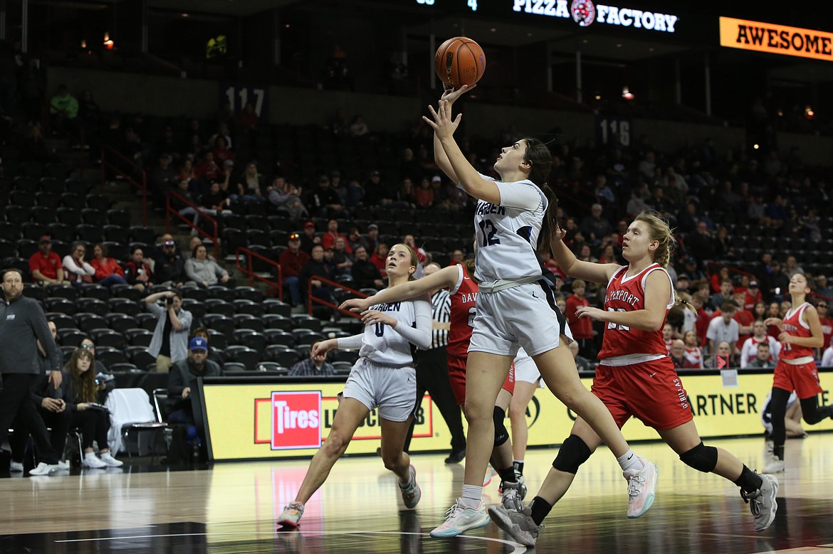 Warden senior Aliza Leinweber (12) takes a shot in the third quarter against Davenport during the 2B Girls State Basketball Tournament Wednesday in Spokane.