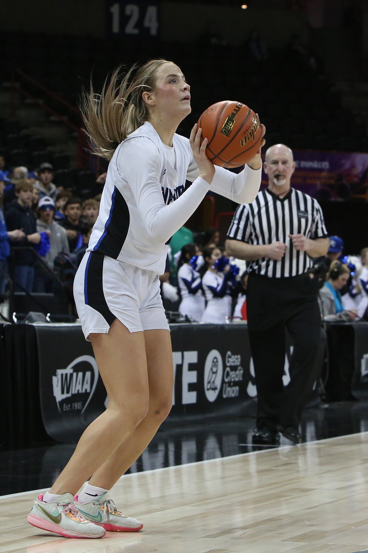 Warden senior Lauryn Madsen shoots a three-pointer in the second quarter against Davenport. Madsen led the Cougars with 22 points in the win.