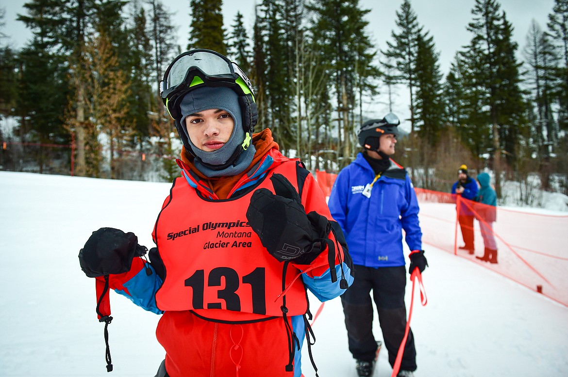 Cole Garvey, with the Eureka Magic team, gives a thumbs-up after his run in the Alpine Slalom event with Dream Adaptive coach Adrian Miller during the Special Olympics Montana Glacier Area Winter Games at Whitefish Mountain Resort on Thursday, Feb. 29. (Casey Kreider/Daily Inter Lake)