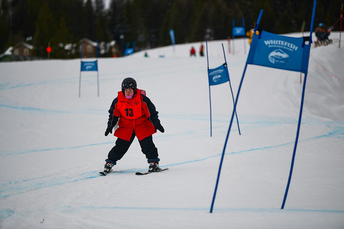 Elizabeth Daughton, with the Eureka Magic team, weaves between gates in the Alpine Slalom event during the Special Olympics Montana Glacier Area Winter Games at Whitefish Mountain Resort on Thursday, Feb. 29. (Casey Kreider/Daily Inter Lake)