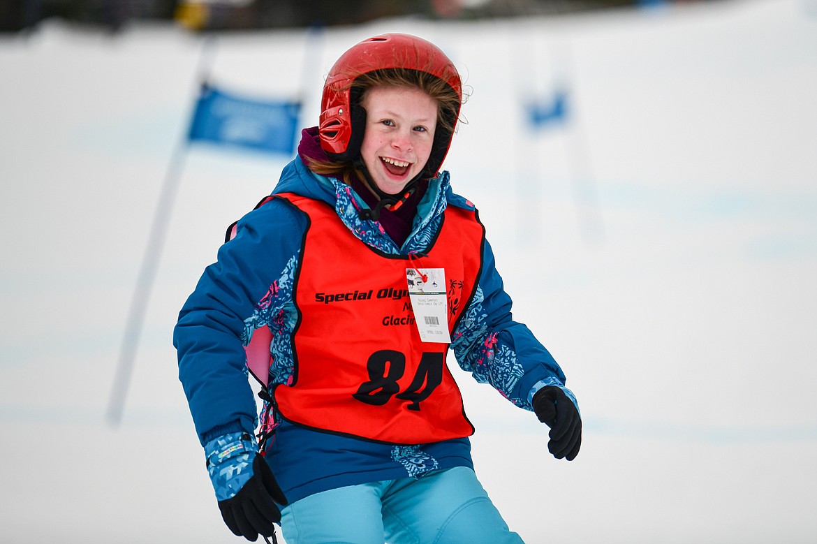 Alivia Westphal, with the Kalispell Public Schools team, flashes a smile as she crosses the finish line in the Alpine Slalom event during the Special Olympics Montana Glacier Area Winter Games at Whitefish Mountain Resort on Thursday, Feb. 29. (Casey Kreider/Daily Inter Lake)