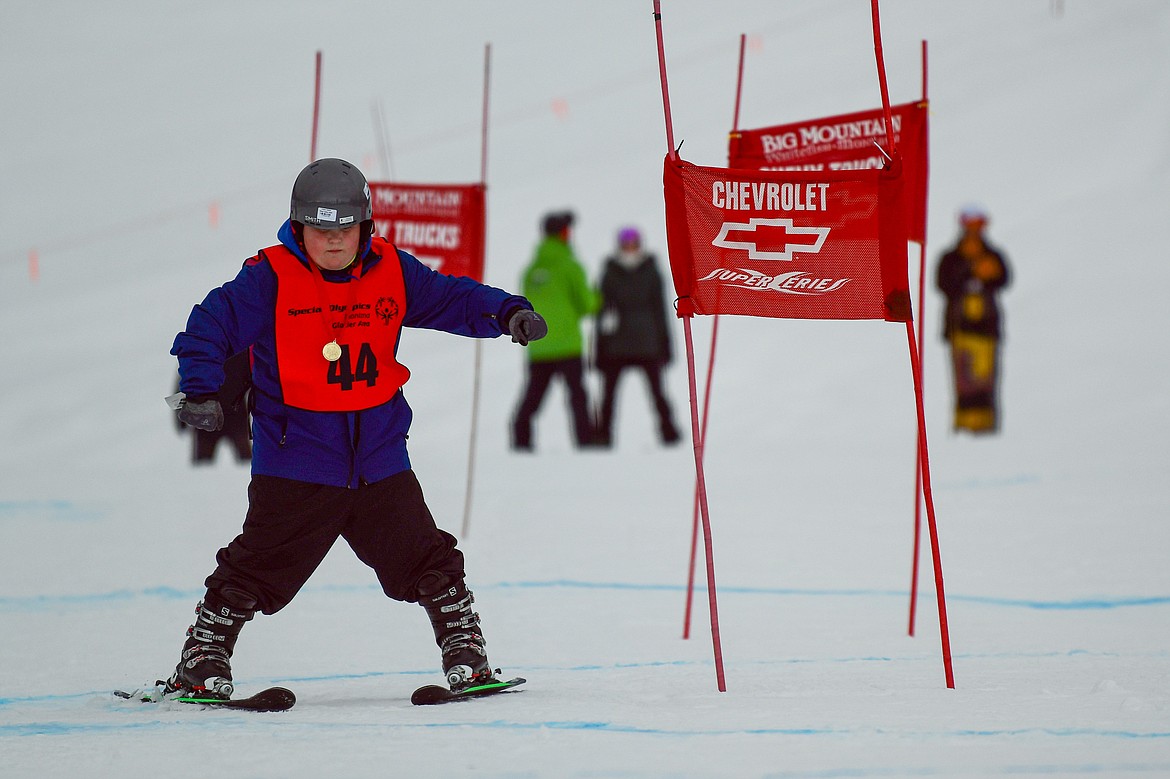 Chase Helzer, with the West Valley Warriors team, weaves between gates in the Alpine Glide event during the Special Olympics Montana Glacier Area Winter Games at Whitefish Mountain Resort on Thursday, Feb. 29. (Casey Kreider/Daily Inter Lake)
