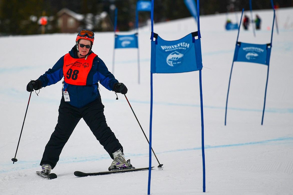 Anne Trout, with the Lighthouse Christian Home team, weaves between gates in the Alpine Slalom event during the Special Olympics Montana Glacier Area Winter Games at Whitefish Mountain Resort on Thursday, Feb. 29. (Casey Kreider/Daily Inter Lake)