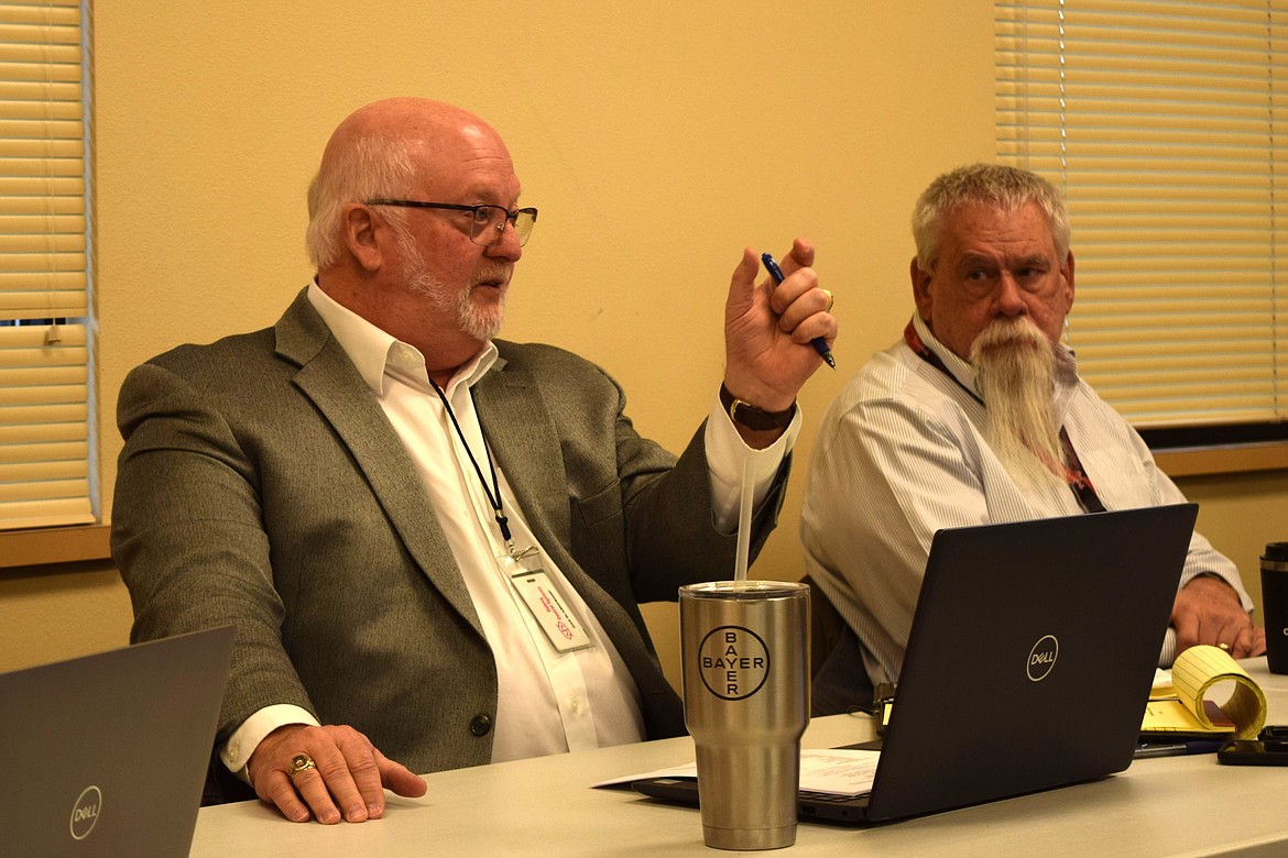 Adams County Commissioners Dan Blankenship, left, and Jay R. Weise, right, discuss business during a December board workshop in Othello’s Adams County District Courthouse. The county took part in an exit interview for its 2022 accountability audit Tuesday.