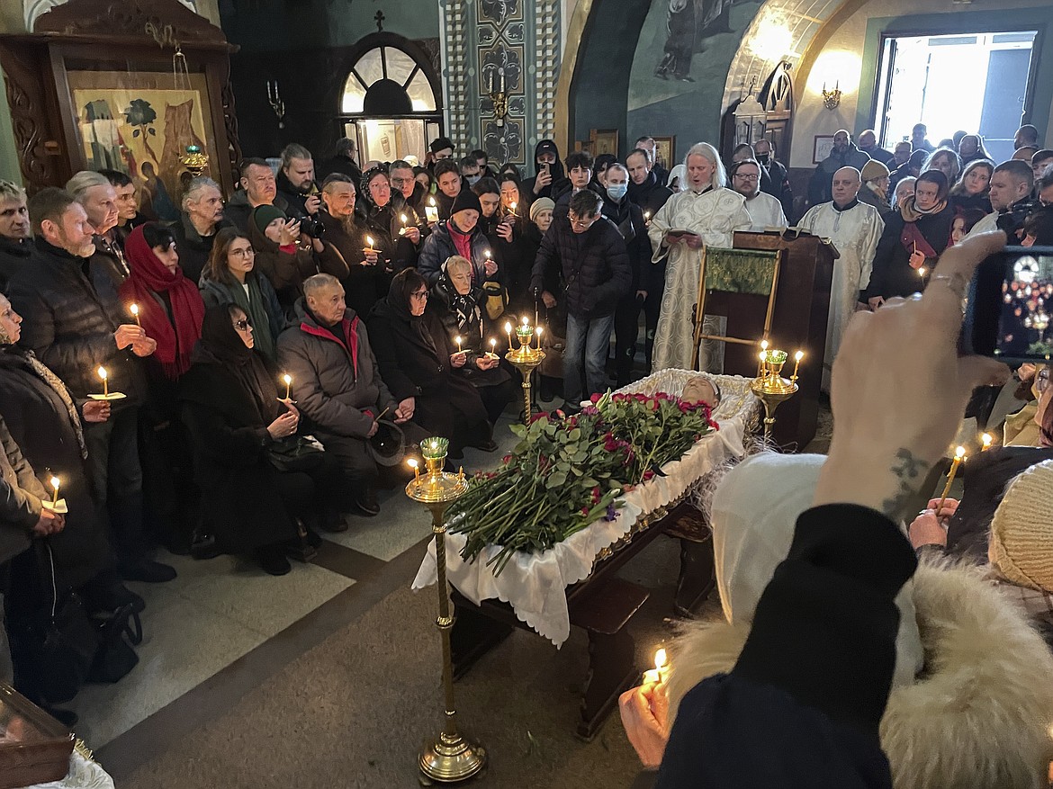 Relatives and friends pay their last respects at the coffin of Russian opposition leader Alexei Navalny in the Church of the Icon of the Mother of God Soothe My Sorrows, in Moscow, Russia, Friday, March 1, 2024. (AP Photo)