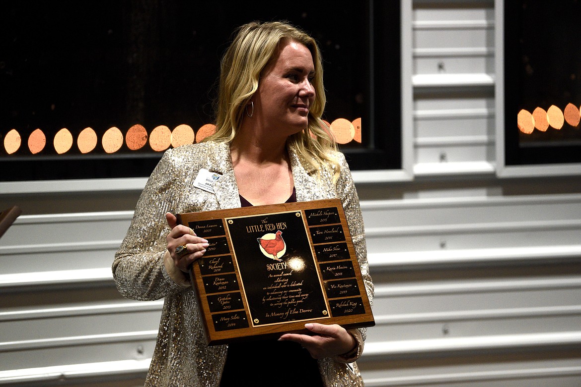 Board president Jill Parish holds the Red Hen award at the Bigfork Chamber of Commerce banquet and awards ceremony in Bigfork on Thursday, Feb. 22, 2024. (Matt Baldwin/Daily Inter Lake)