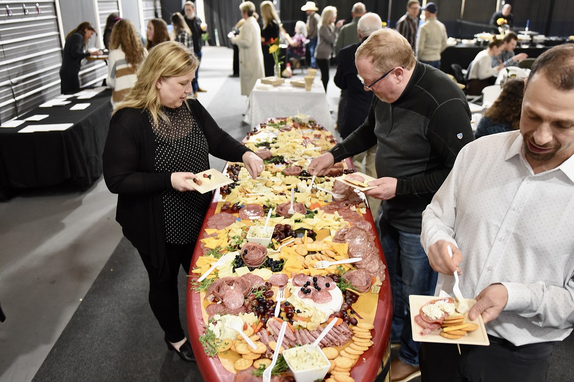 Guests enjoy a charcuterie board at the Bigfork Chamber of Commerce banquet and awards ceremony in Bigfork on Thursday, Feb. 22, 2024. (Matt Baldwin/Daily Inter Lake)