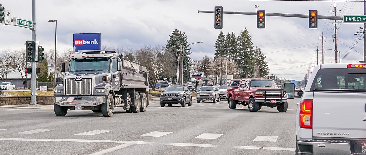 Traffic flows on Government Way on Friday. Concerns have the city contemplating whether it would be feasible for them to take over traffic light synchronization.