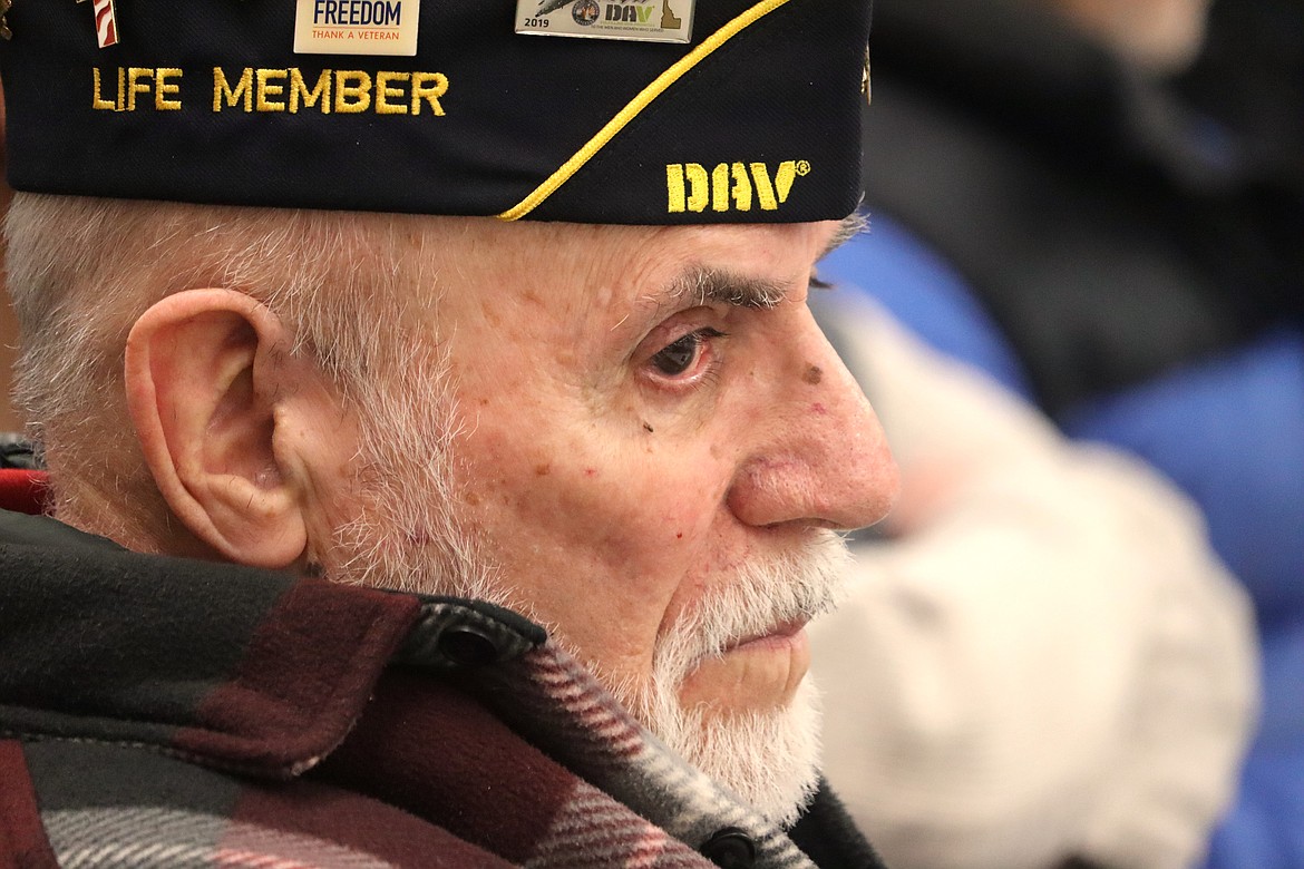 Ray Almeida listens to a speaker during his Quilt of Valor ceremony on Tuesday at the Idaho National Guard Armory in Post Falls.