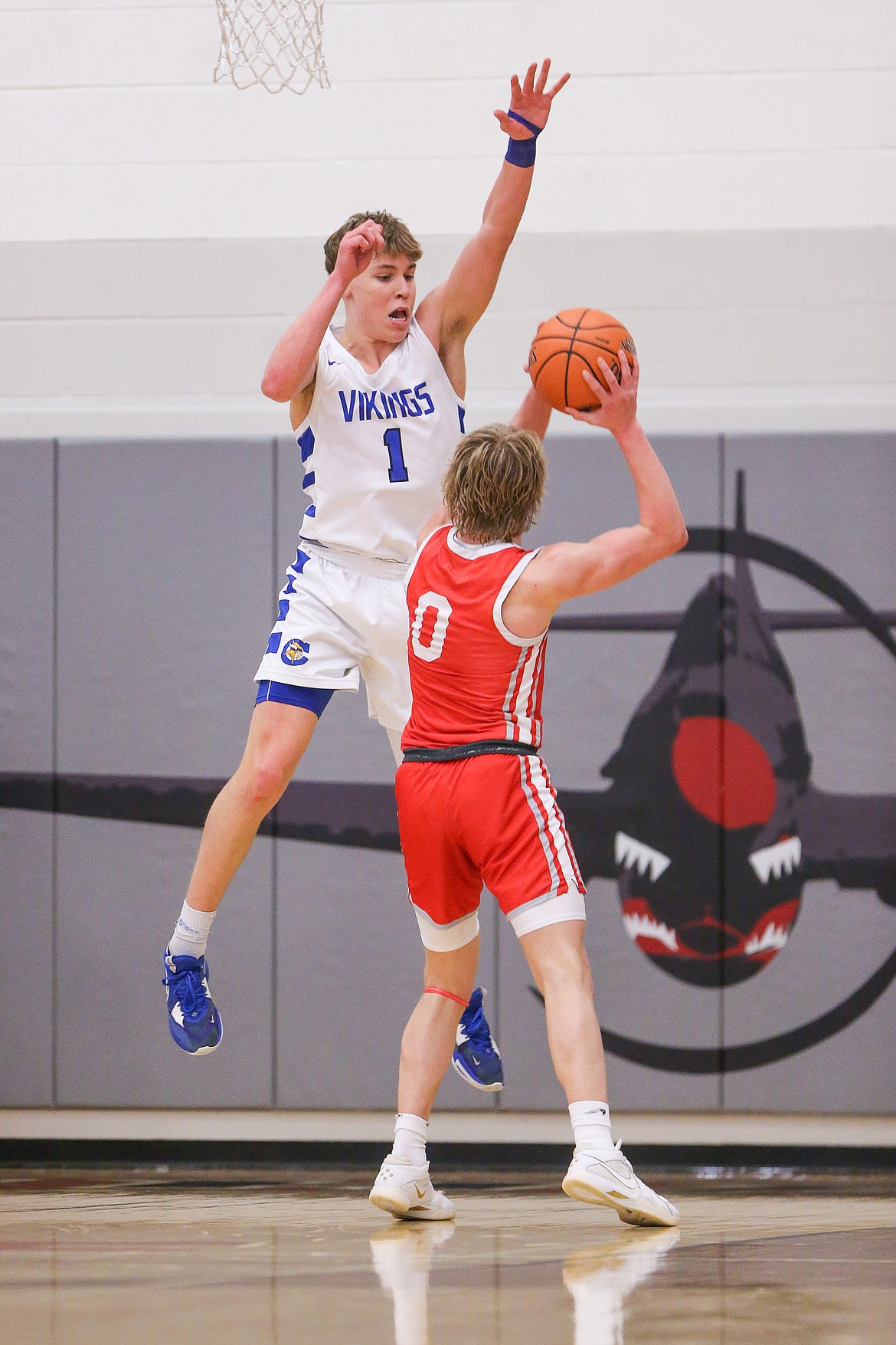 JASON DUCHOW PHOTOGRAPHY
Coeur d'Alene senior guard Logan Orchard defends Madison's Nash Humphreys during Saturday's state 5A boys basketball third-place game at Ridgevue High in Nampa.