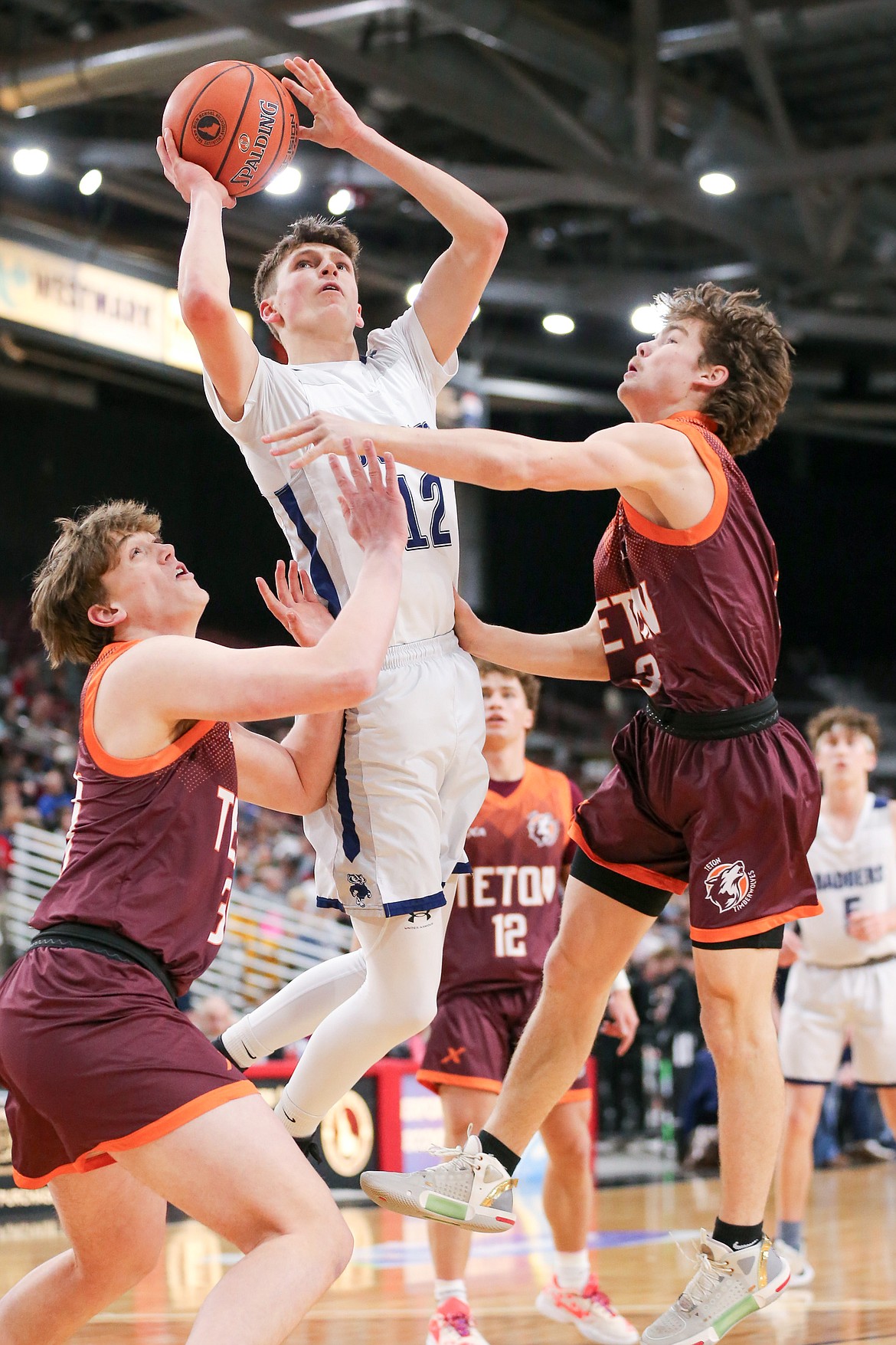 JASON DUCHOW PHOTOGRAPHY
Bonners Ferry junior guard Asher Williams splits the Teton defense during Saturday's state 3A boys basketball championship game at the Ford Idaho Center in Nampa.