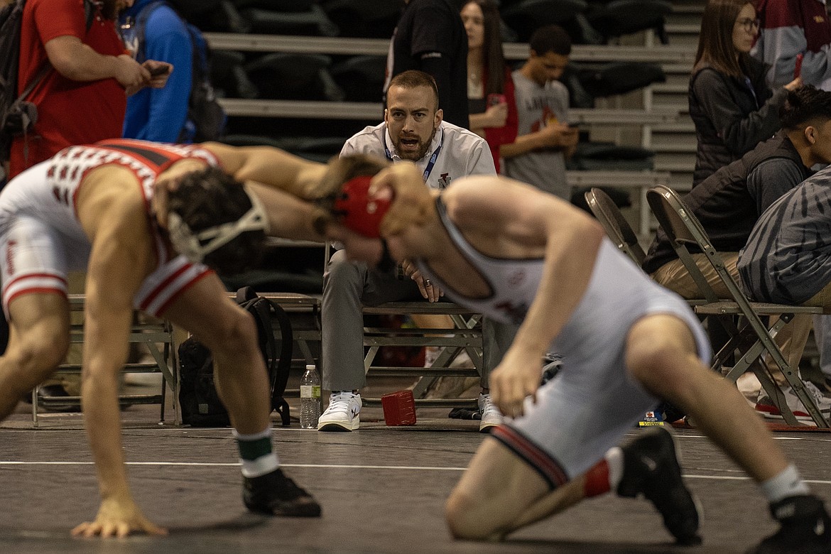 ELLI MICHAEL/North Idaho College
North Idaho College head wrestling coach Derrick Booth shouts instructions to Porter Craig during his third-place match at 157 pounds at the NJCAA Tournament at the Mid-American Center in Council Bluffs, Iowa on Saturday.