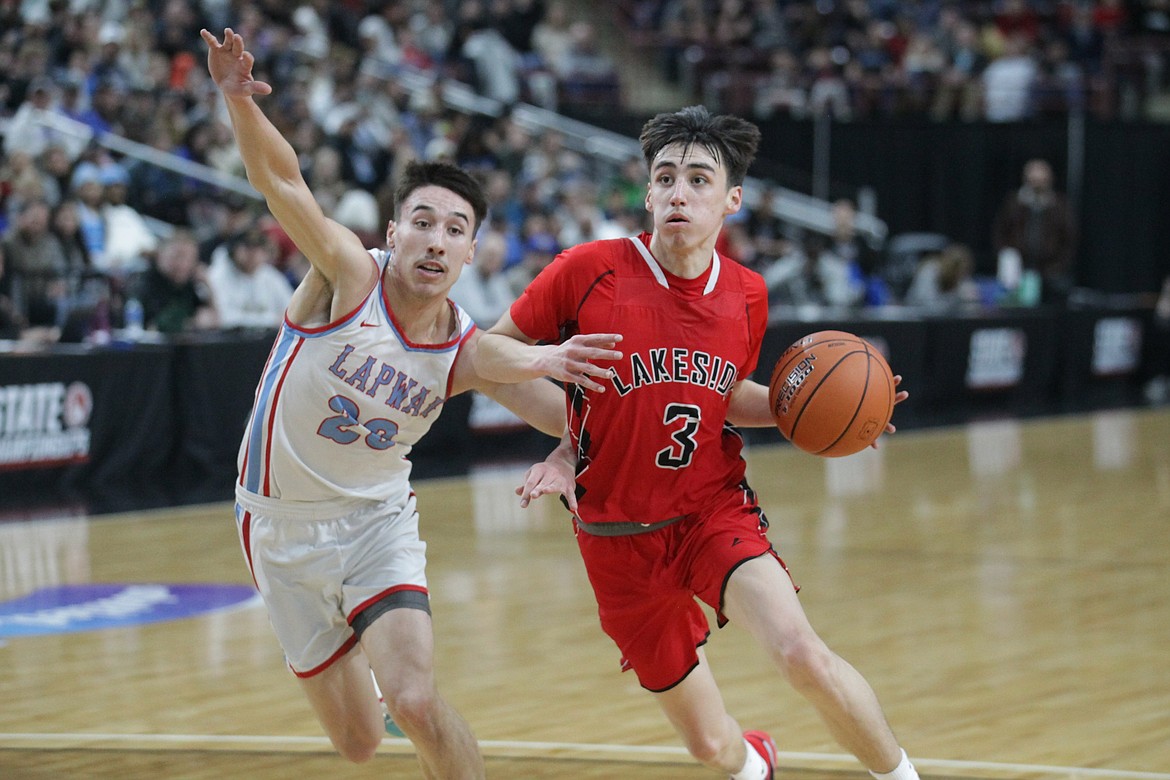 MARK NELKE/Press
Lakeside senior Brutus SiJohn (3) drives to the basket as Ahlius Yearout of Lapwai defends Saturday during the state 1A Division 1 championship game at the Ford Idaho Center in Nampa.