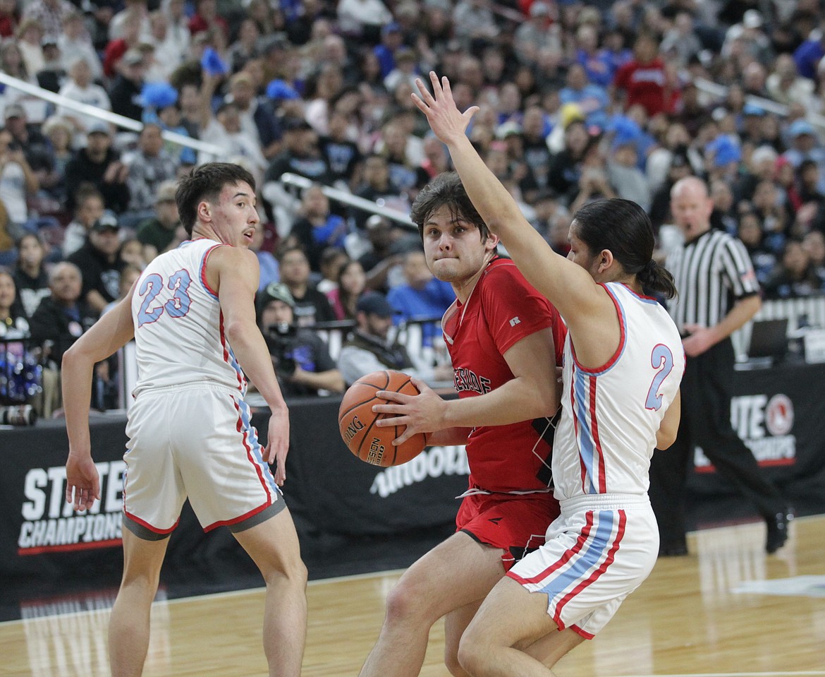 MARK NELKE/Press
Lakeside senior Liam Hendrickx drives to the basket as Ahlius Yearout (23) and Joseph Payne (2) of Lapwai defend on Saturday during the state 1A Division 1 championship game at the Ford Idaho Center in Nampa.