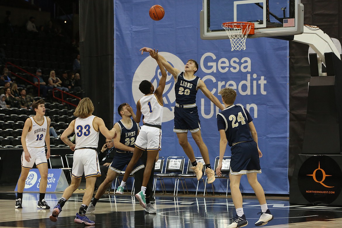 MLCA/CCS freshman Max Gulenko (20) blocks a shot in the first half against Columbia Adventist.