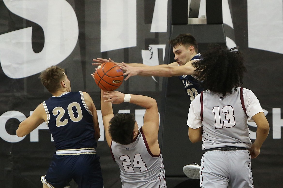 MLCA/CCS sophomore Dennis Gulenko (32) blocks a potential game-winning shot against Lummi Nation in the final seconds of the fourth quarter.