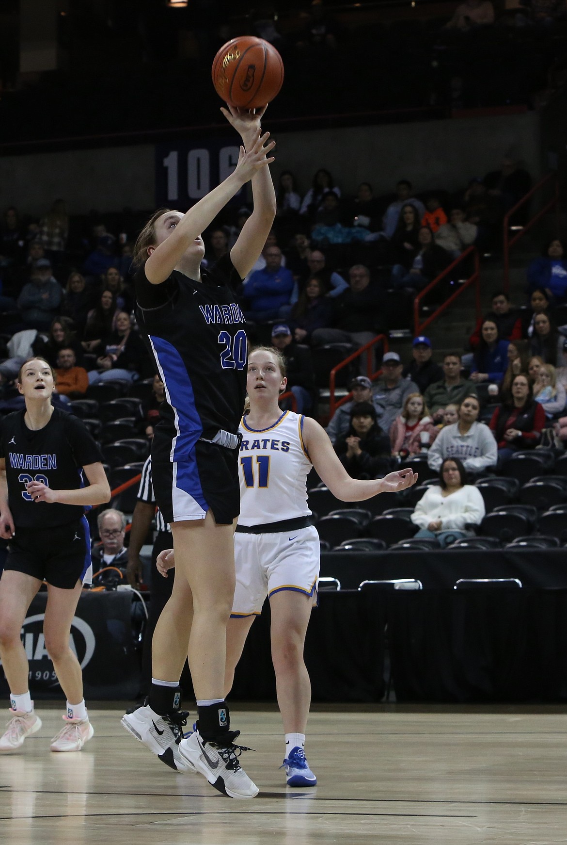 Warden senior Molly Sackmann (20) lays the ball in for a basket in the second quarter against Adna.