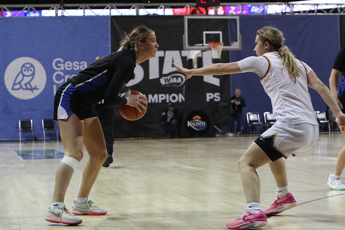 Warden senior Lauryn Madsen, left, looks for an open teammate in the third quarter against Adna.