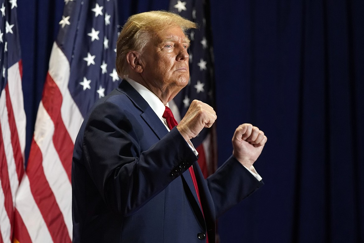 Republican presidential candidate former President Donald Trump gestures at a campaign rally, March 2, 2024, in Richmond, Va. The Supreme Court has restored Donald Trump to 2024 presidential primary ballots, rejecting state attempts to hold the Republican former president accountable for the Capitol riot. The justices ruled a day before the Super Tuesday primaries that states cannot invoke a post-Civil War constitutional provision to keep presidential candidates from appearing on ballots. (AP Photo/Steve Helber, File)