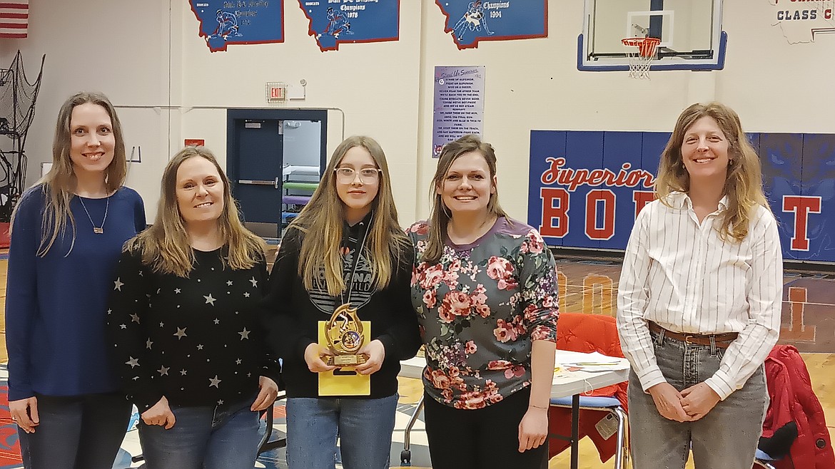 Daisy Sansom, center, an eighth-grade student in St. Regis, won the Mineral County Spelling Bee. Also pictured, from left, judge Chelsea Nygaard from Superior, pronouncer Angie Hopwood from Superior, judge Kelsey Clark form St. Regis and judge Katy Cannon from Alberton. (Monte Turner/Minderal Independent)