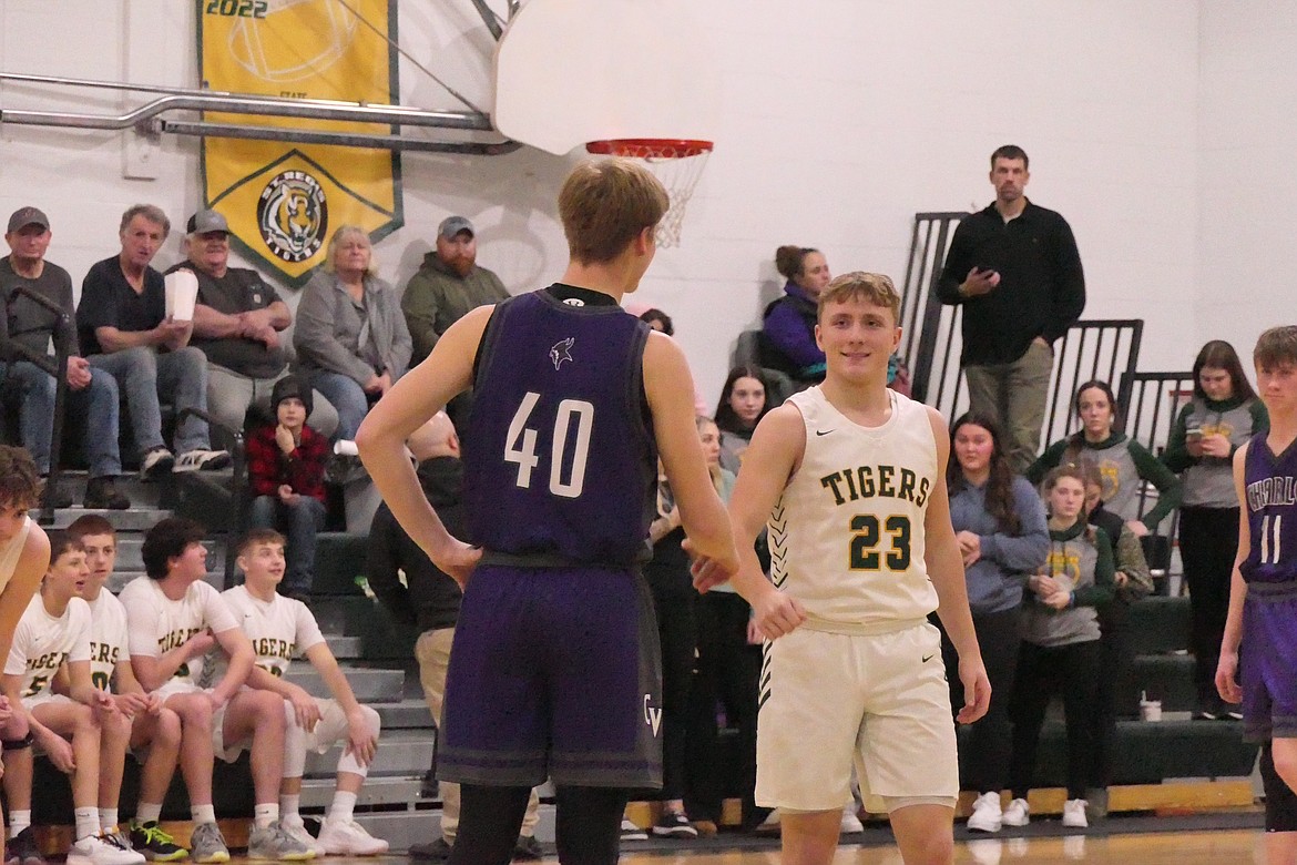 St. Regis senior John Pruitt, named to the Class C All-state and the District 14C first team all-star rosters, prepares to jump ball against District 14 first teamer Wesley Anderson (40) during a regular season game this year.  (Chuck Bandel/VP-MI)