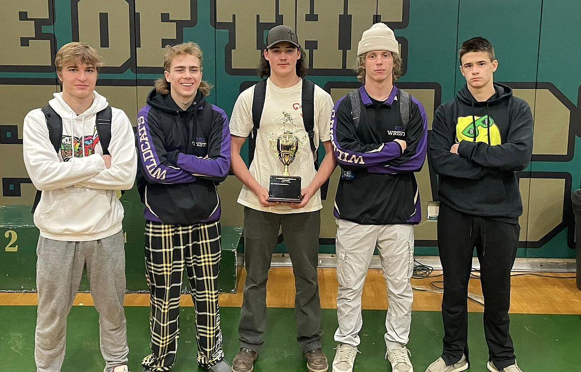 Seniors Jaeger Hall, Kolter Wood, Travis Eixenberger, Ramsey Rainio and Kolby Lemmon celebrate their final district championship as members of the Kellogg High School wrestling team.