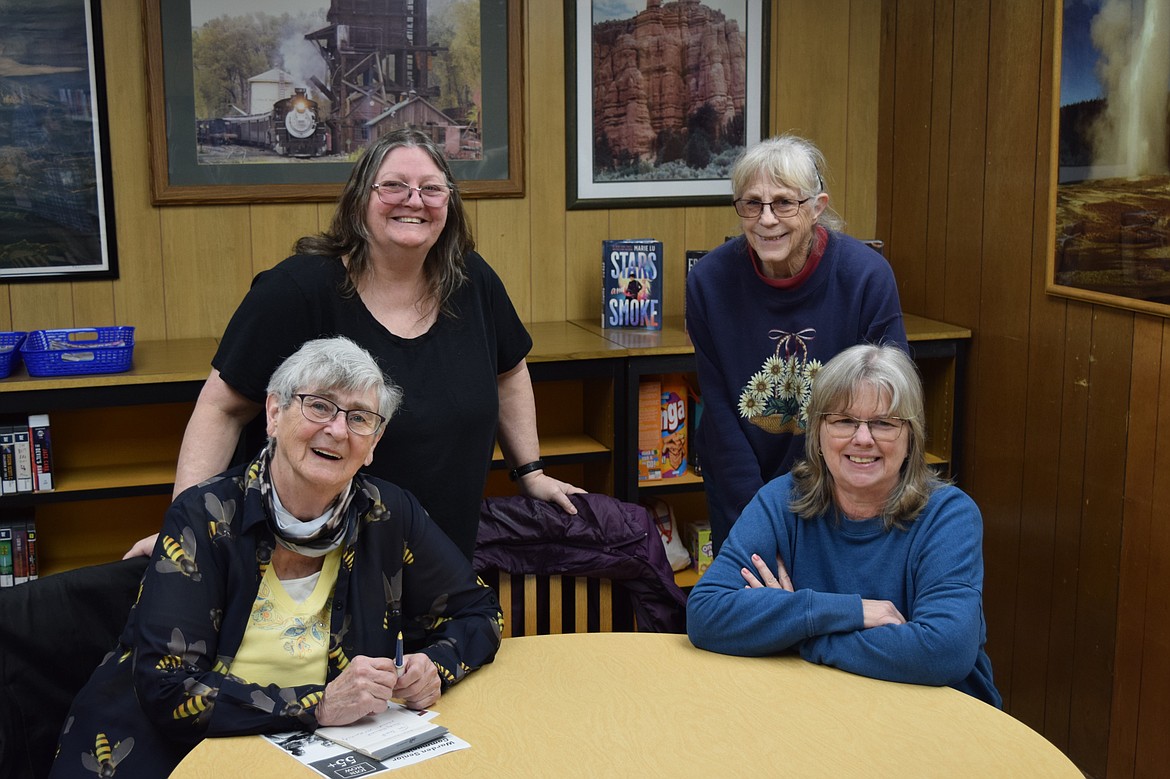 Attendees of Saturday’s senior group, Tinker Ansel, standing left, Jean Echols, sitting left, Trudy Richmond, standing right, and Darla Haworth, sitting right, meet inside the Warden Public Library.