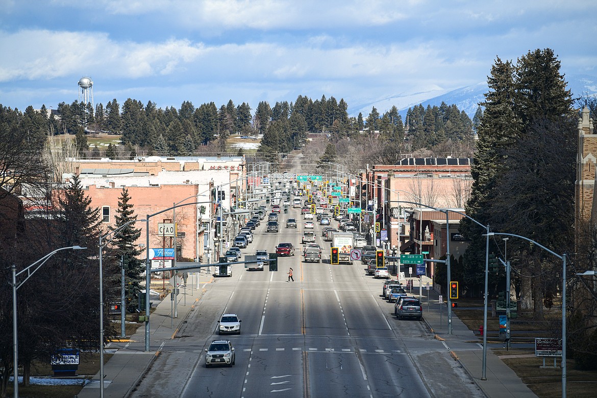 A pedestrian crosses Main Street at Fifth Street in Kalispell on Tuesday, March 5. (Casey Kreider/Daily Inter Lake)