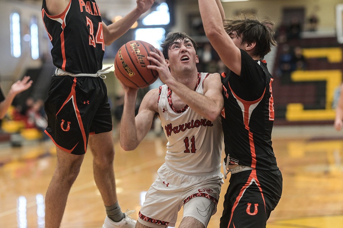 Warrior Kendall O'Neill prepares to take a shot during the Divisional matchup with Plains Feb. 22 at the SKC gym. (Christa Umphrey photo)