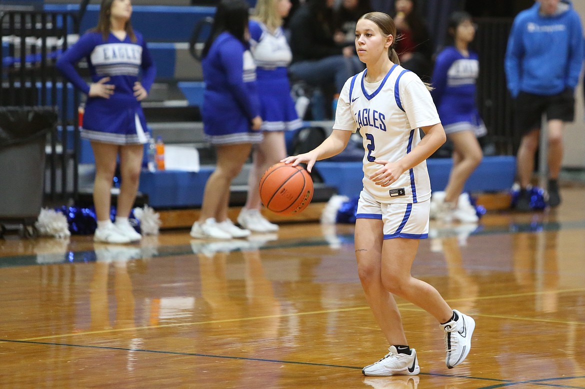 Olivia McCrady, the lone upperclassman on the Soap Lake girls basketball team, brings the ball up the court.