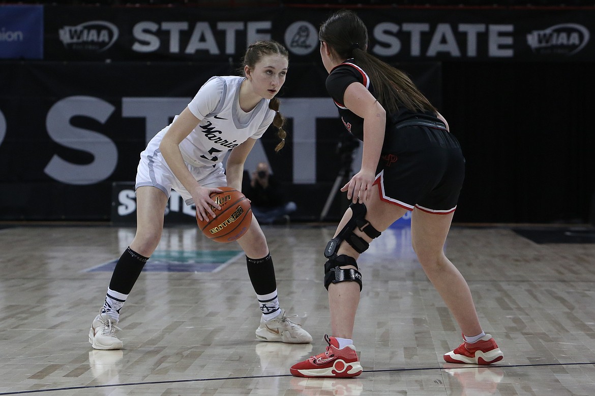 Almira/Coulee-Hartline junior Emma Whitaker, in white, looks for an open teammate during a game against Garfield-Palouse.