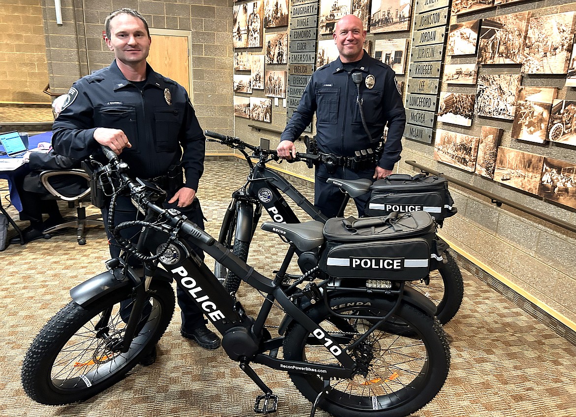 Coeur d'Alene police Lt. Jon Cantrell, left, and Capt. Jeff Walther stand by two of the department's new ebikes Tuesday. Ebike patrols will begin May 1 in the downtown area.