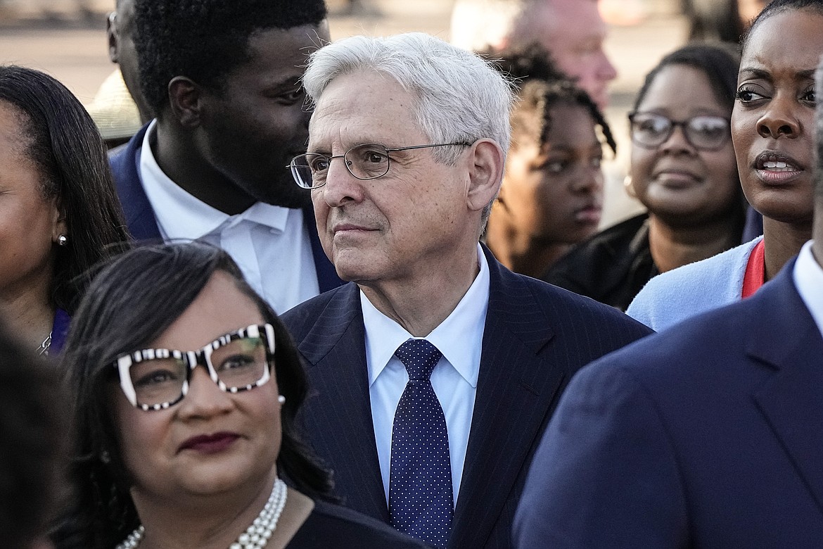 United States Attorney General Merrick Garland stands with marchers before they walk across the Edmund Pettus Bridge commemorating the 59th anniversary of the Bloody Sunday voting rights march in 1965, Sunday, March 3, 2024, in Selma, Ala. (AP Photo/Mike Stewart)