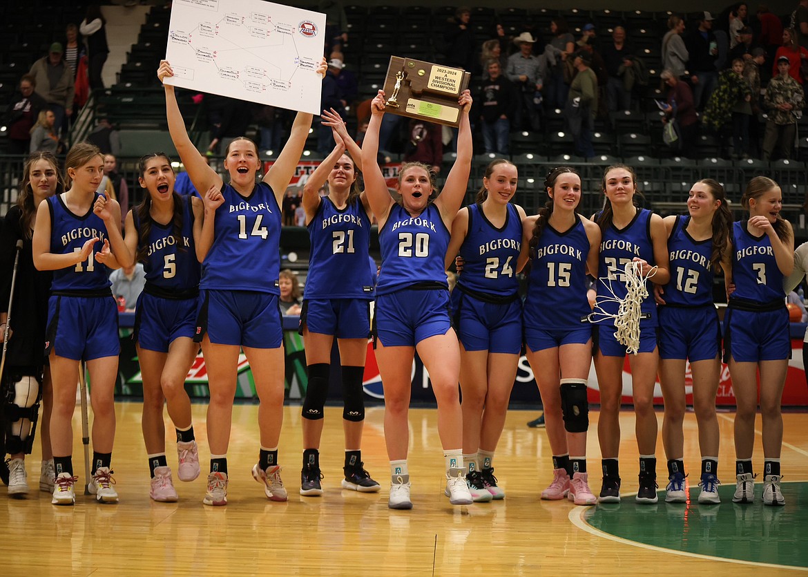 THE BIGFORK VALKYRIES celebrate their Western A Divisional title, earned with a 41-29 victory over Frenchtown on Feb. 24 in Butte. The Vals head to the State A tournament on the same Civic Center score with a 20-1 record. (Jeremy Weber/Bigfork Eagle)