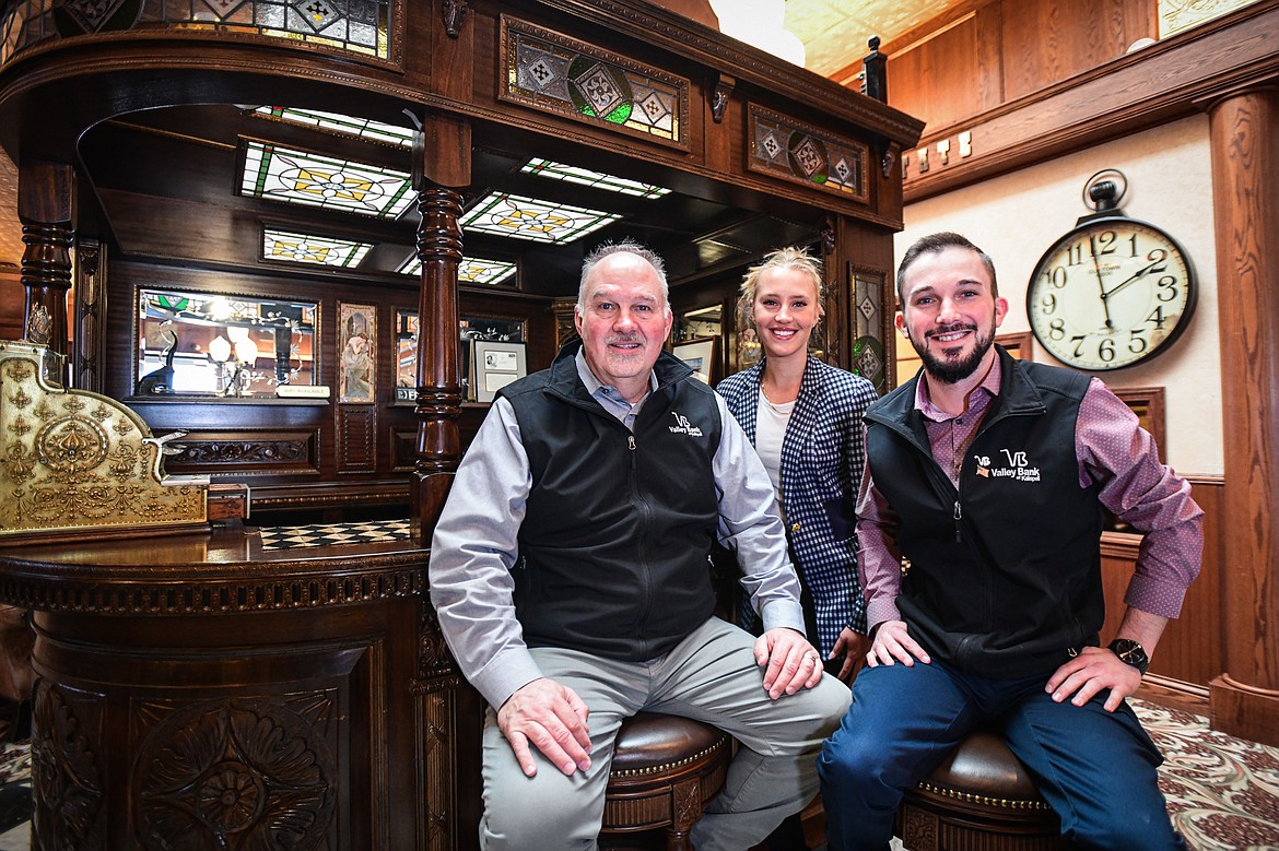 Mark, Chloe and Logan Hensley at Valley Bank in Kalispell on Wednesday, March 6. (Casey Kreider/Daily Inter Lake)