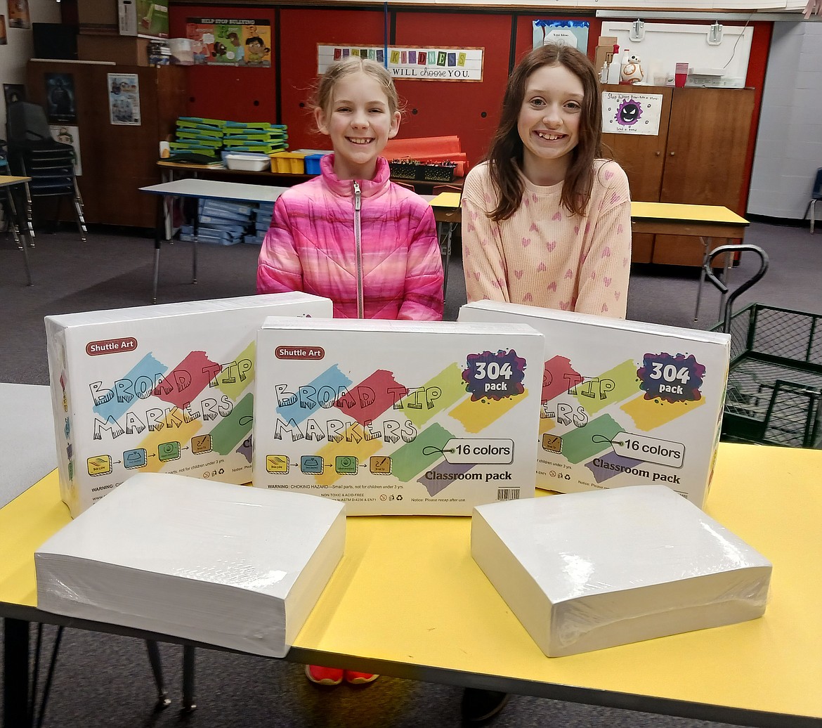 Ponderosa Elementary School students Olivia Clark, left, and Payton Hahnenkratt are all smiles over new markers delivered in mid-February for Jerry Gadek's exploratory art classes. The markers were among $7,000 in supplies Art on the Green and the Citizens' Council for the Arts sponsored for arts programs in Coeur d'Alene and Post Falls schools.