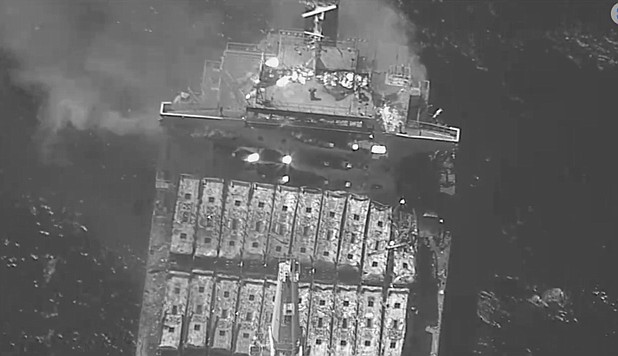 This black-and-white image released by the U.S. military's Central Command shows the fire aboard the bulk carrier True Confidence after a missile attack by Yemen's Houthi rebels in the Gulf of Aden on Wednesday, March 6, 2024. A missile attack by Yemen's Houthi rebels on a commercial ship in the Gulf of Aden on Wednesday killed three of its crew members and forced survivors to abandon the vessel, the U.S. military said. It was the first fatal strike in a campaign of assaults by the Iranian-backed group over Israel's war on Hamas in the Gaza Strip. (U.S. Central Command via AP)