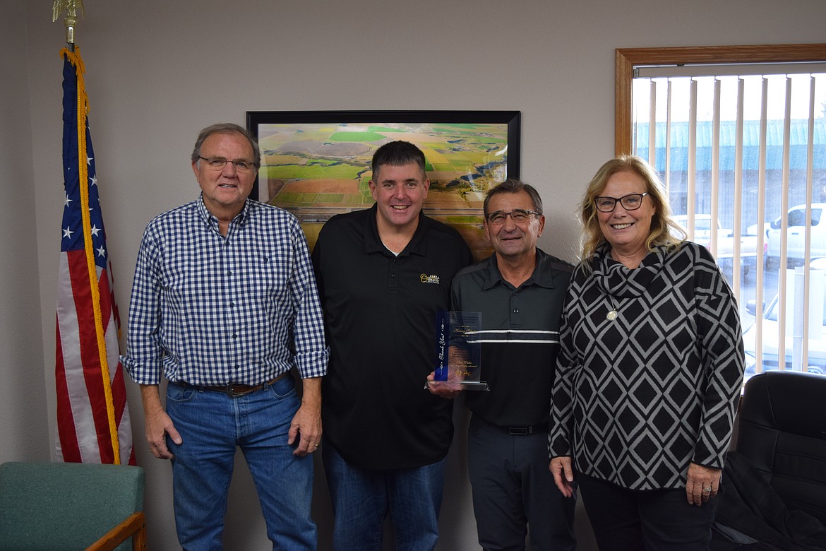 Othello’s 2023 Woman of the Year and Port of Othello Commissioner Deena Vietzke, right, stands with Commissioner Gary Weaver, Port Executive Director Chris Faix and former Commissioner Kenny Schutte to celebrate Schutte’s 24 years with the port.