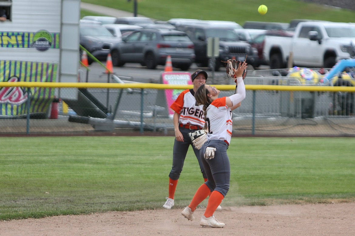 Ephrata junior Kaydence Hector, foreground, catches a fly ball in the infield during the Central Washington Athletic Conference district tournament.