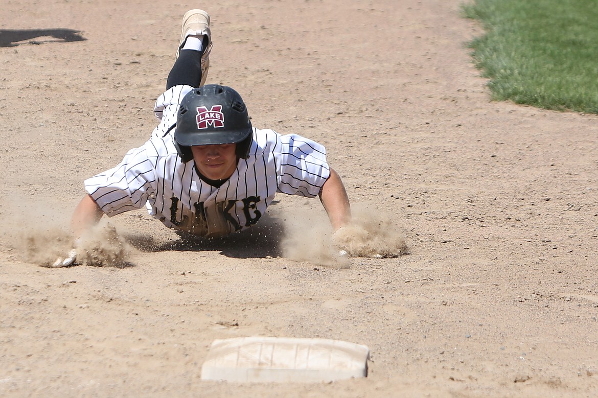 Moses Lake senior Jayce Stuart slides into third base during a game against Eastmont in the 2023 season.