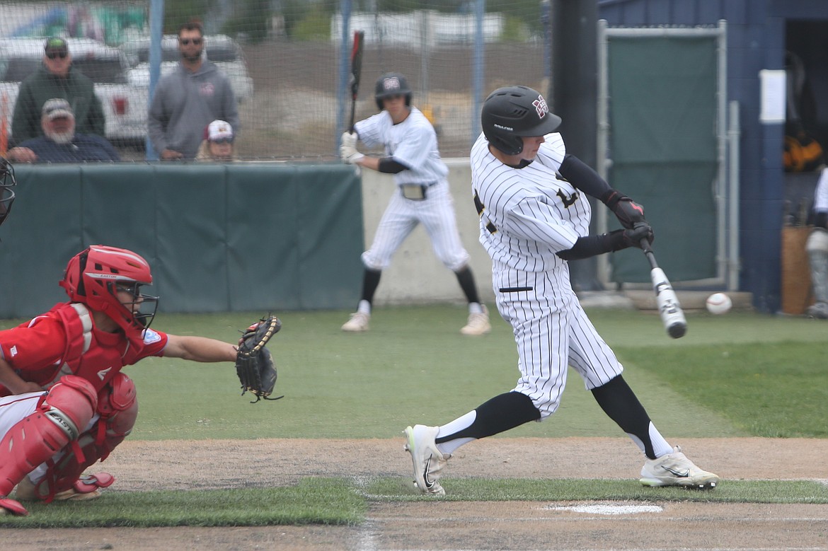 Moses Lake junior Adrian Martinez, right, makes contact with a pitch during a game against West Valley (Yakima) last season.