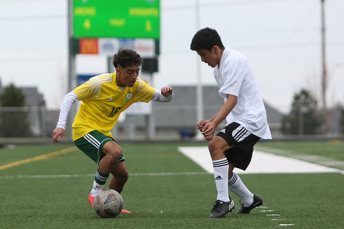 Quincy senior Alexander Murillo, left, looks to shake past a Royal defender during a game in the 2023 season.