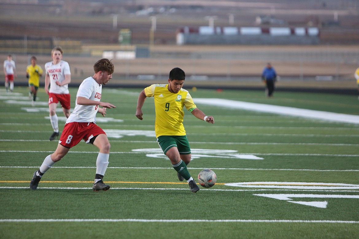 Quincy’s Jorge Nunez, right, works the ball upfield in a 2023 game against Cascade (Leavenworth). Nunez was one of seven Jackrabbits that graduated from last year’s team.