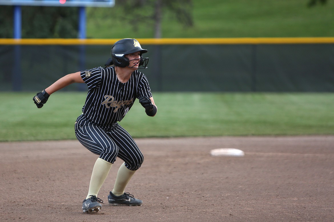 Royal junior Audrey Bergeson keeps her eye on the ball as the runs to third base.