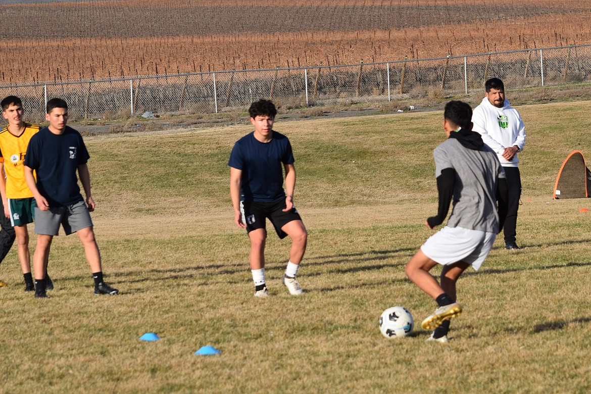 Soccer players fight for the ball during practice drills outside Wahluke High School for the school’s Boys Soccer team.