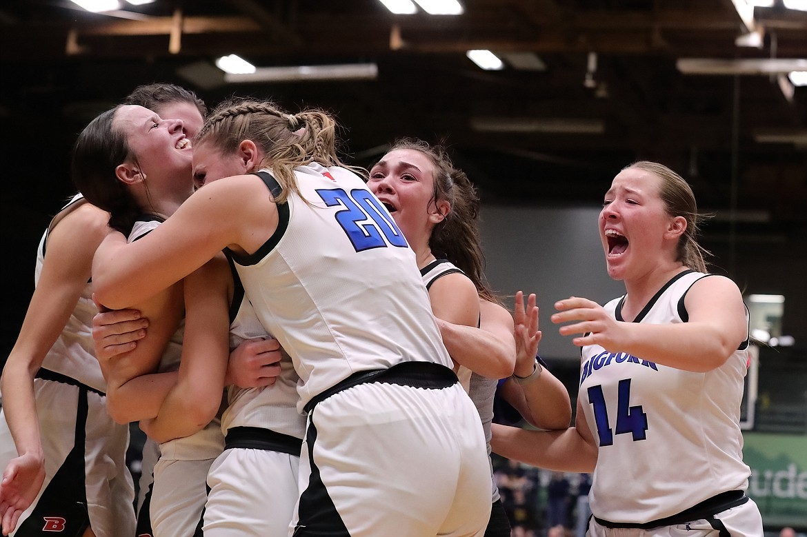 BIGFORK’S AVA DAVEY, left, is swarmed by her teammates after hitting the game-winning shot in the Valkyries’ 34-32 win over Miles City Friday. (Gregory Nelson/artwestimage.com)